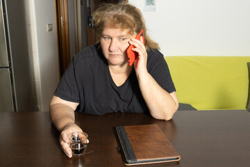 Woman making phone call contemplating serious discussion