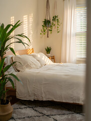 Mental reset space Empty bed with linen sheets morning light window view plants calm sanctuary rest