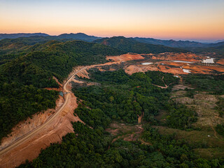 Scenic aerial view of Tad Ma Waterfall and surrounding farmland, emphasizing water abundance, green terraces, and sustainable agriculture in Vientiane, Laos.