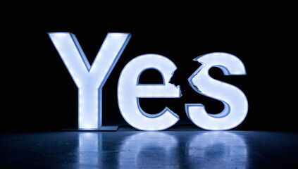 Glowing Blue "Yes" Sign on Dark Background