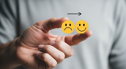 Hand Holding Sad To Happy Face Emoticons Representing Mood Change And Positive Transformation