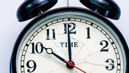 Cracked Vintage Alarm Clock Showing 10:10