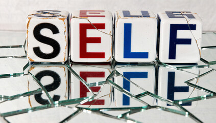 Broken Dice Spelling "Self" on Shattered Glass