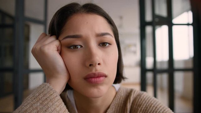 POV webcam tired bored lazy Hispanic woman at home scrolling using mobile phone point of view girl Latina addict touch screen smartphone addiction social media browsing internet boring female relaxing