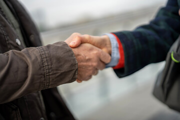 People shaking hands forming agreement and partnership