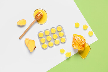 Cough drops in blister with ginger root slices, honeycomb and dipper on color background