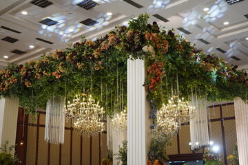 Luxury Wedding Stage Decoration with Floral Canopy and Crystal Chandeliers