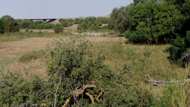 Wide landscape view of a bridge on US 83 as it crosses over the Dismal River in central Nebraska