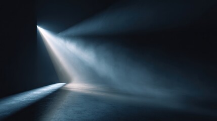 Dramatic scene of a darkened, aged room. Strong light streams diagonally through an opening, illuminating the dusty air and floor