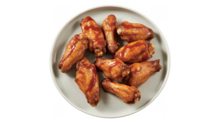 Glazed chicken wings on a white plate food isolated on a transparent background