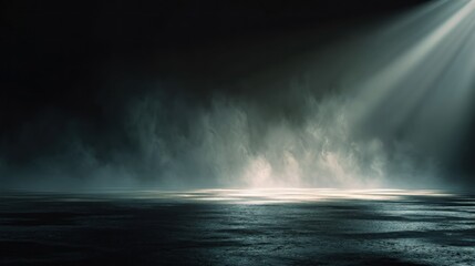 Beam of light illuminates a dark stage floor, with vaporous smoke rising and reflective surface below