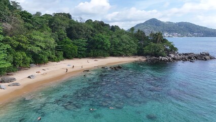 One of Phukets secret Beaches with crystal clear Water, Rocks and a beautiful Reef
