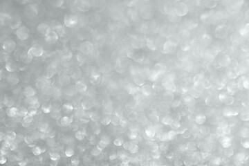 Abstract silver glitter sparkle texture with bokeh background