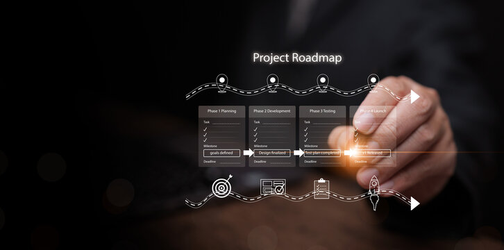 Project roadmap concept. Businessman hand writing on digital infographic showing planning, development, testing, and launch phases for strategic business journey, startup, strategy and management.