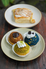 Sweet assorted pastries with colorful cream puffs, soft airy texture, creamy rich filling, and delightful dessert flavor, modern caf&eacute; style presentation with inviting visuals and appetizing charm