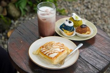 Sweet assorted pastries with colorful cream puffs, soft airy texture, creamy rich filling, and delightful dessert flavor, modern caf&eacute; style presentation with inviting visuals and appetizing charm