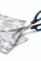 Scissors cut through aluminum foil with precision, creating a clean and shiny edge. Perfect for crafting or household use, simple and effective.