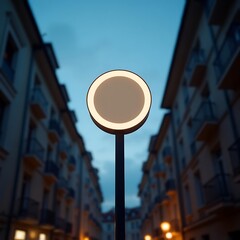 A modern street lamp stands tall in a quiet urban alleyway at dusk