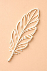 Minimalist white feather design on a soft peach background. The feather is abstract, crafted with smooth, curved lines for a simple, elegant look.