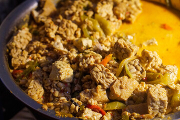 Assorted traditional Indonesian dishes with vibrant homemade flavors, mixed vegetables, fried fish, savory side dishes, and rustic market-style presentation, rich cultural culinary visuals