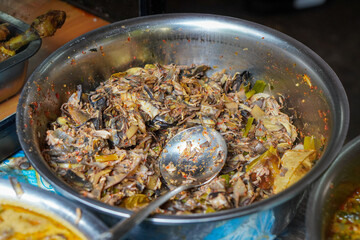 Assorted traditional Indonesian dishes with vibrant homemade flavors, mixed vegetables, fried fish, savory side dishes, and rustic market-style presentation, rich cultural culinary visuals