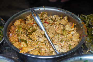 Assorted traditional Indonesian dishes with vibrant homemade flavors, mixed vegetables, fried fish, savory side dishes, and rustic market-style presentation, rich cultural culinary visuals