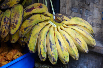 Assorted traditional Indonesian dishes with vibrant homemade flavors, mixed vegetables, fried fish, savory side dishes, and rustic market-style presentation, rich cultural culinary visuals
