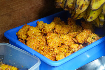 Assorted traditional Indonesian dishes with vibrant homemade flavors, mixed vegetables, fried fish, savory side dishes, and rustic market-style presentation, rich cultural culinary visuals