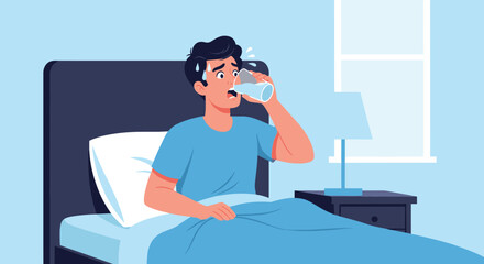 Sweaty man sitting up in bed at night drinking a glass of cool water to hydrate during a very hot summer evening or high fever.