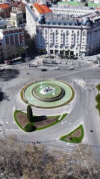 Neptuno Fountain In Madrid Spain. City Skyline Showing Modern And Traditional Architecture. Business Sky Downtown Cityscape. Backgrounds Panoramic City. Madrid Spain.