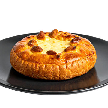 Jani cheese, a traditional Latvian caraway seed cheese, served on a wooden board and isolated on a white background.