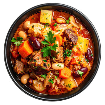 Jota, a traditional Slovenian bean and sauerkraut stew with potatoes and smoked ribs, isolated on white background.