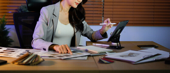 Woman architect designer select material compare samples finishing. Female interior creator choosing renovation materials with swatch spectrum.