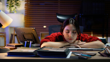 Tired female architect designer in chair at workplace sleep or nap after long day, businesswoman stretching arms while working at desk work overtime, peace, stress free concept