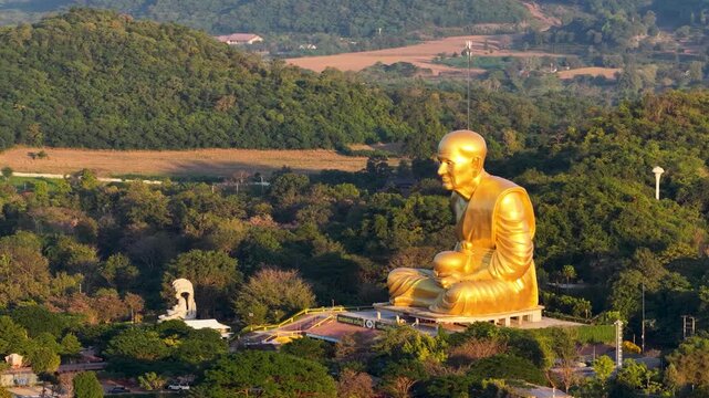 Aerial View of Large Golden Luang Pu Thuat Statue in Khao Yai