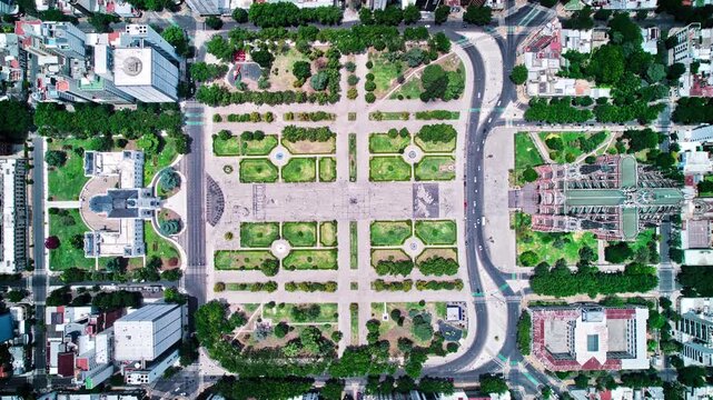 Zenithal aerial hyperlapse over Plaza Moreno La Plata revealing geometric park design and surrounding city blocks.