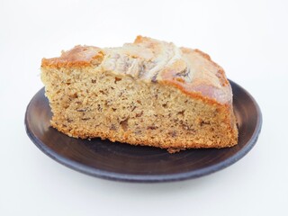 Fototapeta premium The banana cake was placed on a plate. It smelled wonderful and looked and tasted delicious.