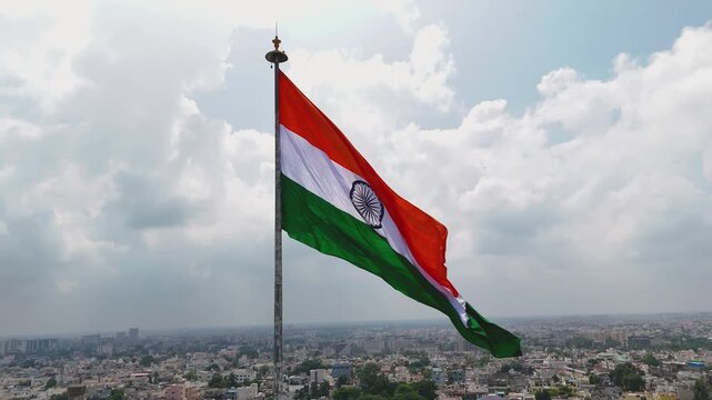 Indian Flag Over Raipur City, Tiranga Flying Above Marine Lake, National Flag Aerial City View, Patriotic Tricolor Over Urban India, Indian Flag Republic Day Drone Shot Stock Video.