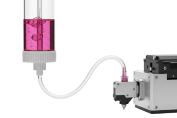 Precision fluid dispensing valve with pink liquid gel on a transparent background