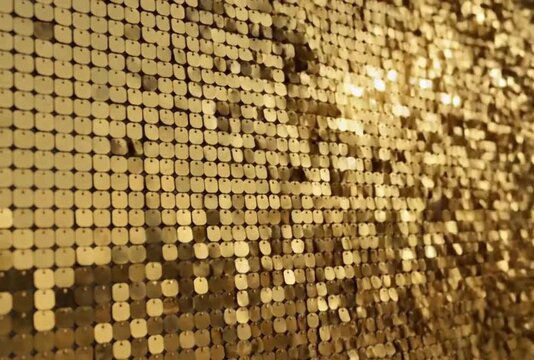 Kinetic gold sequin wall shimmer screen creates luxurious festive background texture dynamic abstract footage shimmering metallic decorative backdrop for celebration and glamour events
