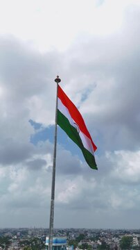 Indian Flag Against Blue Sky, Tricolor Waving in Cloudy Sky, National Flag Freedom Concept, Patriotic Indian Flag Outdoors, Tiranga Flying High Stock Video.