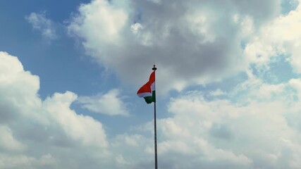 Indian Flag Against Blue Sky, Tricolor Waving in Cloudy Sky, National Flag Freedom Concept, Patriotic Indian Flag Outdoors, Tiranga Flying High Stock Video.