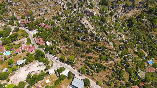 Kayakoy, Turkey. Aerial view of ancient ghost town ruins on hill slope, abandoned Greek village Levissi that inspired the book Birds Without Wings by Louis de Bernieres.. Aerial View, MasterShots, Fl