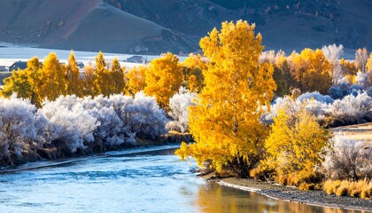 Golden fall foliage adorns riverbanks, with mountains in the distance