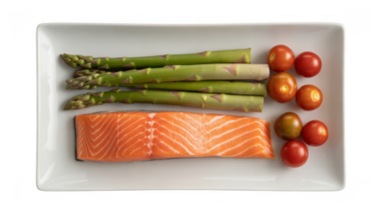 Salmon fillet with asparagus and tomatoes on white plate isolated on a transparent background