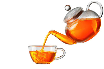 Pouring amber tea from clear teapot into a glass cup