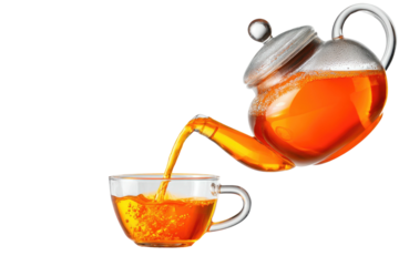 Pouring amber tea from clear teapot into a glass cup