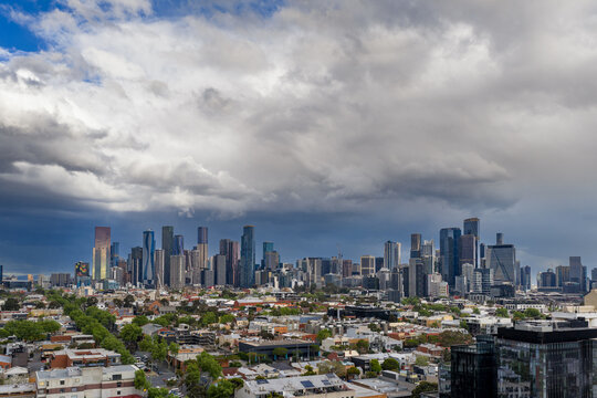 Dark storm clouds and rain over large city skyline Melbourne, Victoria