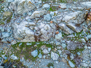 Rugged Rocky Slope With Large Boulders and Small Stream in British Columbia Wilderness