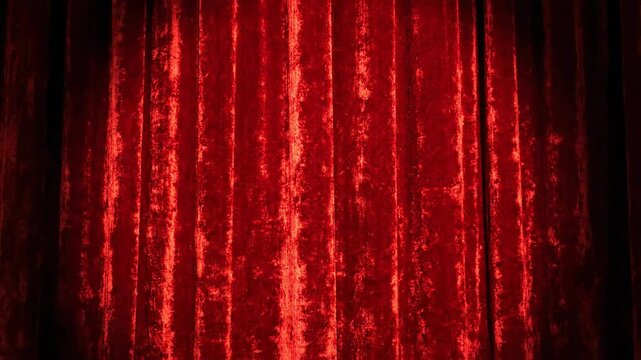 Red curtain backdrop with spotlight for performances and presentations